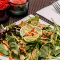 House Salad · Mix salad, lettuce, carrots, lime and homemade dressing.
