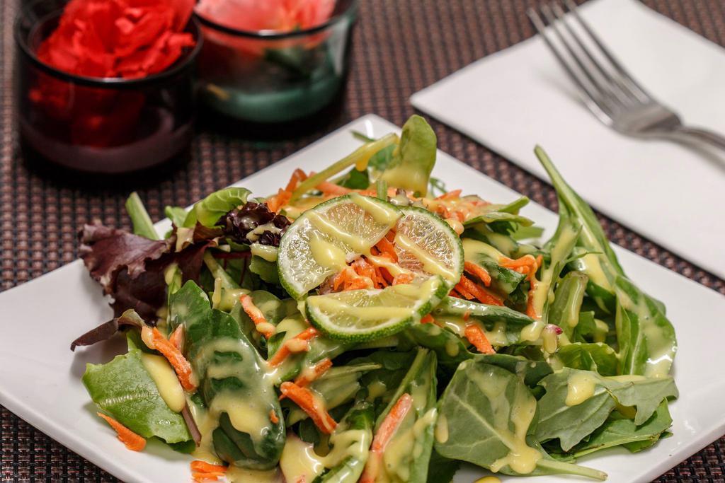 House Salad · Mix salad, lettuce, carrots, lime and homemade dressing.