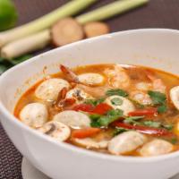 Hot and Sour Soup (Tom Yum) · Hot and sour soup with lemongrass, galangal, kaffir lime leaves, cilantro, mushrooms and chi...