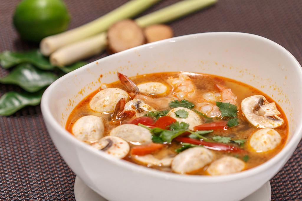 Hot and Sour Soup (Tom Yum) · Hot and sour soup with lemongrass, galangal, kaffir lime leaves, cilantro, mushrooms and chili paste (for vegetarian fresh tofu, carrots and bok choy added).