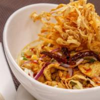 Curry Noodle (Kow Soi) · Spicy. Northern Thai style with chicken, ramen noodle in yellow coconut curry with sliced ca...