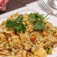 Pineapple Fried Rice · Vegetarian. Fried rice with pineapple, raisins, cashew nuts, eggs, scallions, cilantro and c...