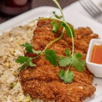 Crispy Chicken Fried Rice · Crispy chicken served with fried rice, eggs, scallions and cilantro served with sweet and so...