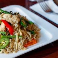 Green Curry Fried Rice · Spicy. Pan-fried rice with green curry paste, green beans, bamboo shoots, jalapeno, bell pep...