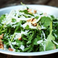 Organic Arugula Salad · Organic baby arugula, shaved fennel, toasted walnuts, grana padano, lemon, olive oil, pink h...