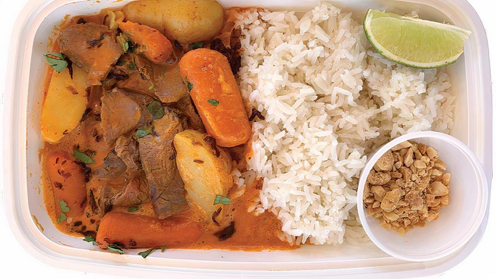 Red Curry Steak (Spicy) · Garlic-Soy Steak, Potatoes, Carrots, Spicy Red Coconut Curry, Fresh Herbs, Lime & Fried Shallots served over Steamed Jasmine Rice. Peanuts provided on the side.