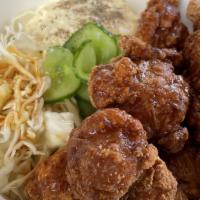 Tori Nanban · Karaage (Fried Chicken), Tangy Soy Glaze, Shredded Cabbage, Egg, Pickled Cucumbers.