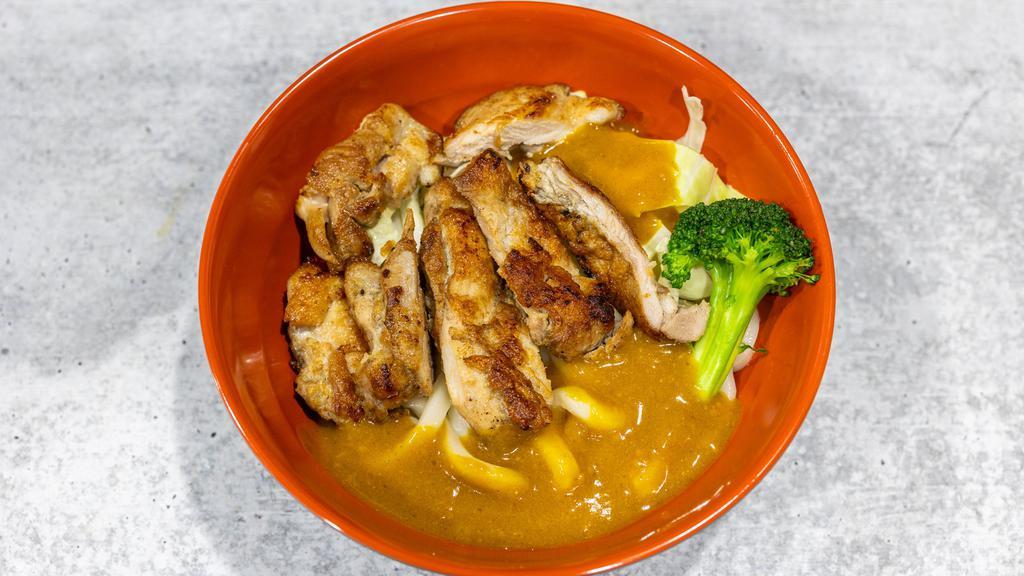 Curry Chicken Udon  · Curry and grilled chicken with Japanese rice noodles.