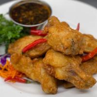 Chicken Wings · (8) deep-fried tempura chicken wings sautéed with chili & garlic sauce tossed with house BBQ...