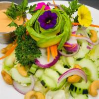 English Cucumber & Avocado Salad · lettuce, red onions, shredded carrots, cucumbers, cashews, avocado, roasted peanuts, & house...