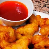 Sweet And Sour Chicken · Breaded Chicken breast deep fried with carrot, onion, green pepper and pineapple. Dipping sa...