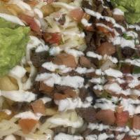 Cali Fries · Choice of meat over fries, melted Oaxaca or jack cheese, pico de gallo, lettuce, tomatillo s...