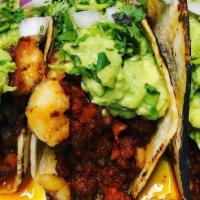 Tacos Governador · Two big crunchy corn tortilla, wrapped in a soft corn tortilla and filled with shrimp & stea...
