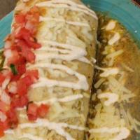 Wet Burrito · Super burrito smothered in red, green, or mole sauce and melted Jack cheese, pico de gallo, ...