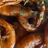 Camarones Al Javi's · 10 shrimp with head, prepared with a slightly spicy sauce, served with rice and salads and t...