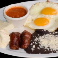 Desayuno El Javi's · Scrambled eggs, cream, fresh cheese, bananas, beans and tortillas.