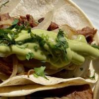 Smoked Brisket Tacos · corn tortillas, caramelized onions, salsa verde lime