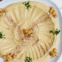 Classic Hummus Plate · A mixture of mashed garbanzo beans, lemon juice, and tahini, and garlic served with pita bre...