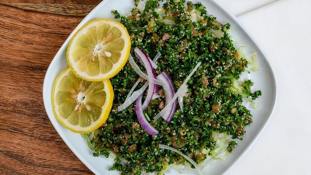 Tabouleh Salad · Vegetarian salad made out of parsley, tomatoes, mint, onions, and olive oil, and lemon juice.