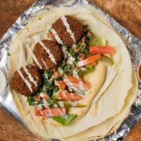 Don't Let Me Falafel Wrap · Ground chickpeas, onions, garlic, and parsley blended with Mediterranean spices, then formed...