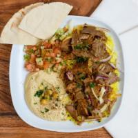 Lamb and Beef Shawarma Combo · Stir-fried shredded lamb and beef marinated in a Mediterranean blend of herbs and spices ser...