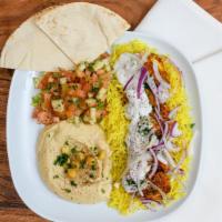 Pride Chicken Bowl · Skewered pieces of chicken breast marinated in a Mediterranean blend of herbs and spices ser...