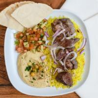 Lambo Bowl · Skewered pieces of lamb marinated in a blend of herbs and spices served with yellow rice and...