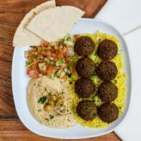 Don't Let Me Falafel · Falafel balls topped with house sauce, white sauce, parsley, and onions served with yellow r...