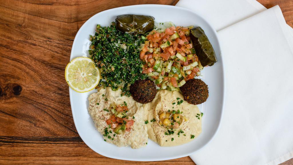 Vegetarian Combo · Hummus, baba ghanoush, med and tabbouleh salad, falafel and dolma.