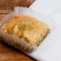 Pistachio Baklava · Buttery, flaky phyllo dough soaked in honey and sugar, stuffed and topped with tender pistac...