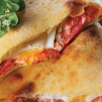 Meat Calzone · Ricotta, pepperoni, salami, Canadian bacon and linguica.