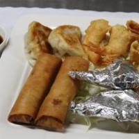 Combination Plate (2 Each) · Fried prawns, spring rolls, crab meat puffs, pot stickers, sesame ball foil wrapped chicken.
