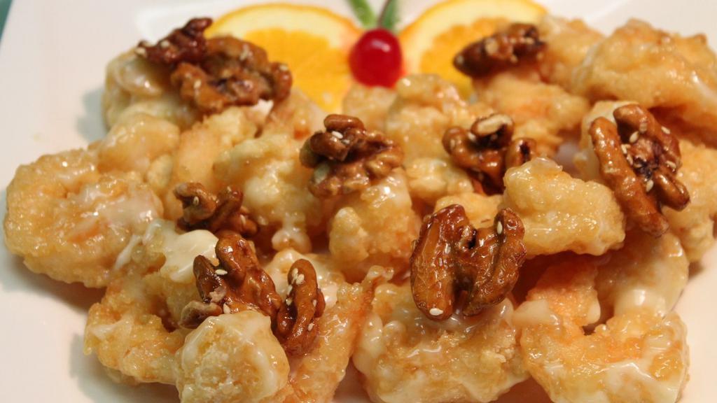Honey Walnut Prawns · Honey roast walnut topped with crispy prawn in sweet white cream.