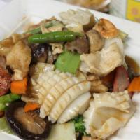 Happy Family · Prawns, scallops calamari, fish fillet, chicken and beef sauteed with vegetables in our chef...
