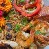 Jambalaya · vegan tomato sauce with holy trinity, grilled peppers and onions, grilled chicken, shimp, an...