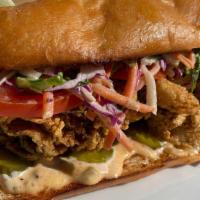 Fried Oyster Po' Boy · fried oyster, vuslaw and pickles in a acme torpedo roll.