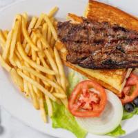 Steak Sandwich · Served with fries - hand cut New York steak on a French roll, lettuce, tomato and onion.