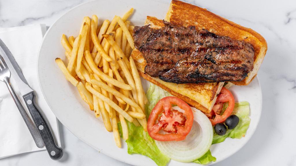 Steak Sandwich · Served with fries - hand cut New York steak on a French roll, lettuce, tomato and onion.