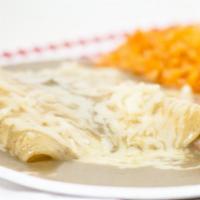 Enchiladas (2) Lunch Plate · Choice of meat or cheese, served with choice of red or green enchilada sauce topped with Mon...