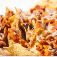 Nachos w/Meat · Tortilla chips topped with beans, Monterey Jack cheese, sour cream and guacamole with choice...