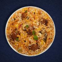 Lala Lamb Biryani · Tender lamb cubes cooked with Indian spices and basmati rice. Served with house raita.
