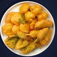 Veggie Views Pakora · Assorted vegetables dipped in a light batter and fried until golden brown.