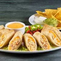 Flautas · 3 rolled corn tortillas with seasonal shredded beef or chicken. served with lettuce guacamol...
