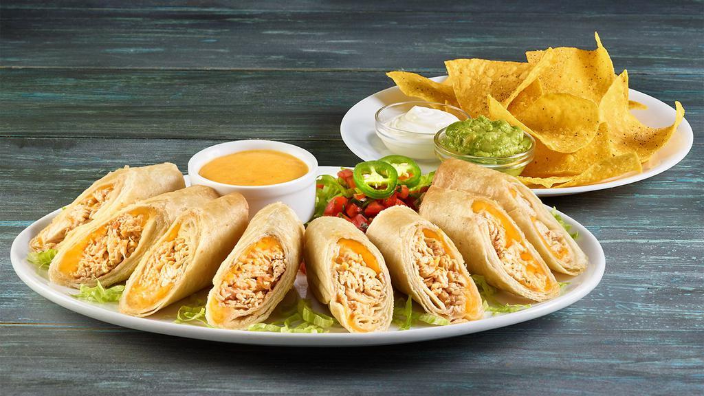 Flautas · 3 rolled corn tortillas with seasonal shredded beef or chicken. served with lettuce guacamole sour cream pico de gallo rice and beans.