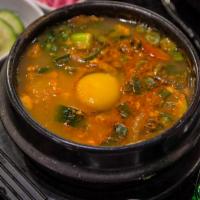 No.114 Spicy Tofu Soup · Spicy or non-spicy soft tofu soup with beef or pork or kim chi and egg.