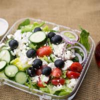 Greek Salad · With lettuce, cucumbers, tomatoes, fresh garden vegetables, feta cheese, kalamata olives, be...