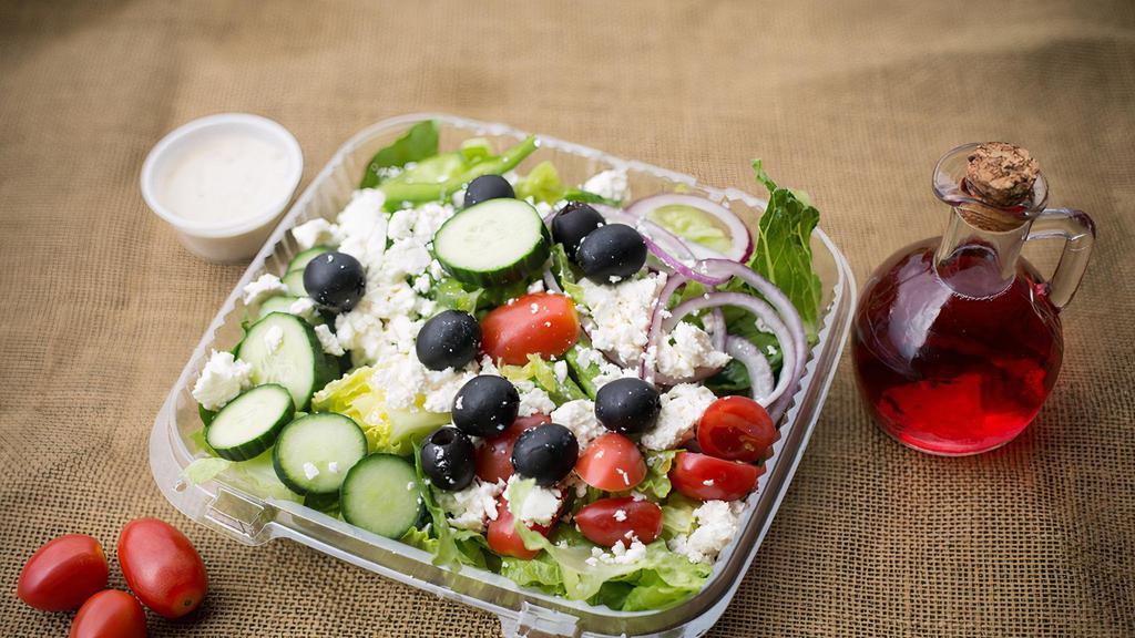 Greek Salad · With lettuce, cucumbers, tomatoes, fresh garden vegetables, feta cheese, kalamata olives, bell pepper, onion and pepperoncini.