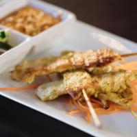 Chicken Satay · Grilled chicken on skewers. Served with peanut sauce and cucumber salad.