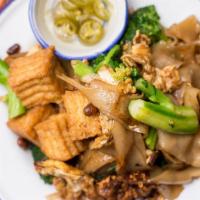 Pad See Ew · Popular noodle dish. Stir fried flat rice noodle with egg, broccoli and Chinese broccoli in ...