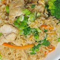 Thai Fried Rice · Simple and flavorful. Stir fried jasmine rice with egg, onion, green onion, and tomato. Topp...